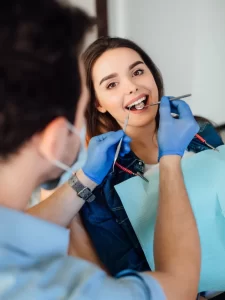 photo-back-professional-dentist-man-working-with-patient-white-office